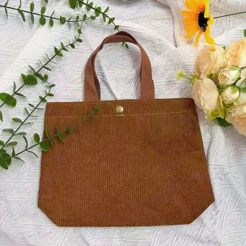 Bolso tote de estilo minimalista con hilo rugoso y estampados a doble cara, un bolso de lona versátil de gran capacidad para mujer