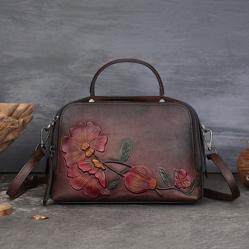 Vintage Cowhide Pillow Bag With Embossed Detailing And A Handheld Design