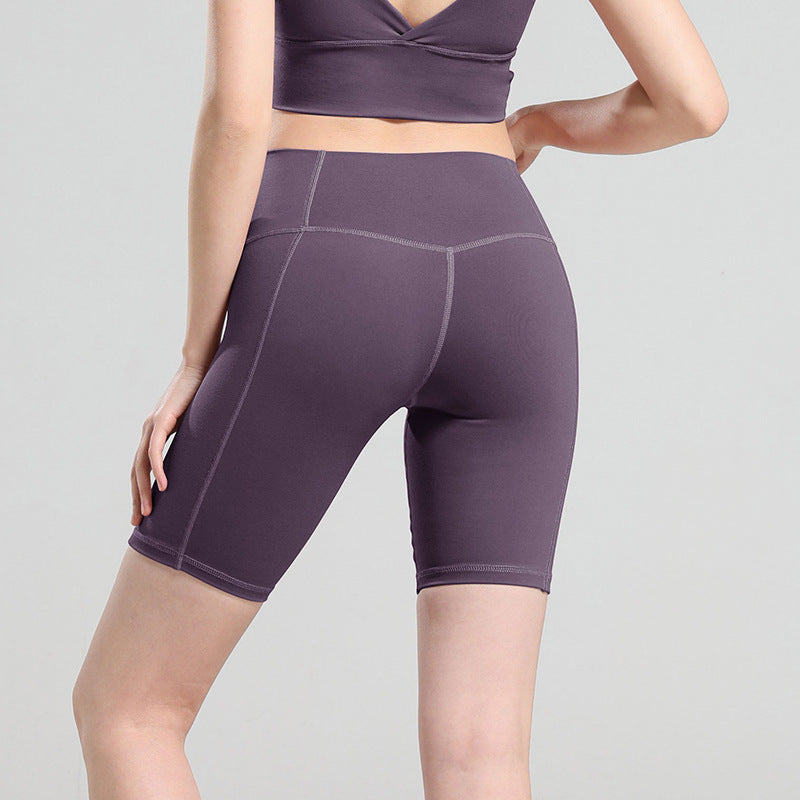 Pantalones cortos de yoga de cintura alta que moldean la cadera
