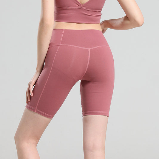 Pantalones cortos de yoga de cintura alta que moldean la cadera
