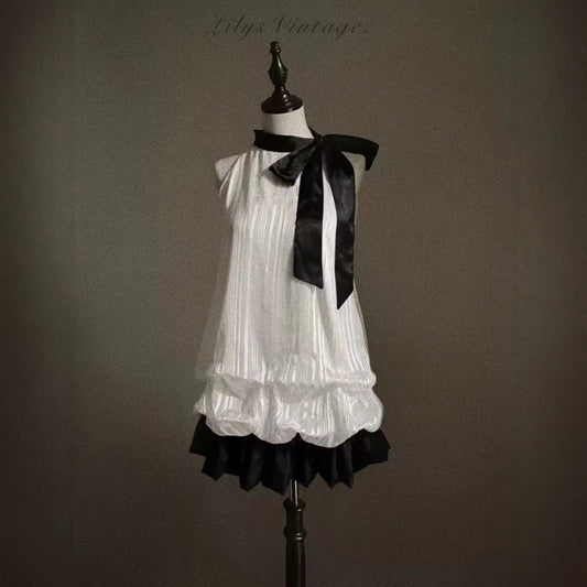 Vestido patchwork con lazo y capullo de flor con cuello halter