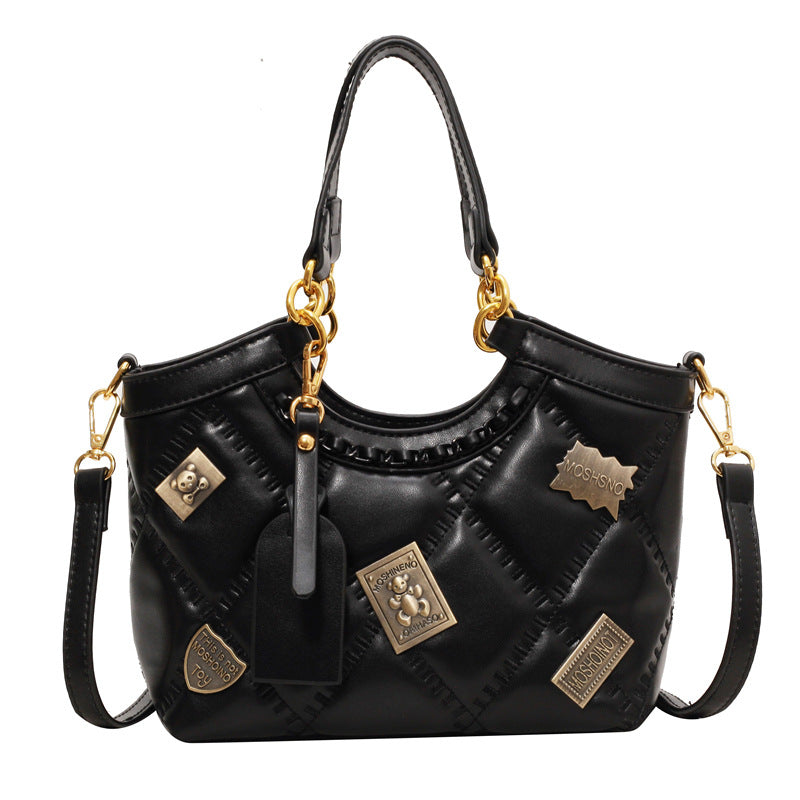 Bolso cruzado de hombro con insignia y patrón de diamantes, rara vez visto