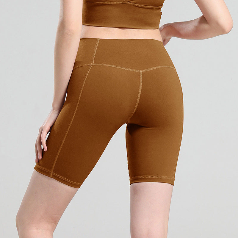 Pantalones cortos de yoga de cintura alta que moldean la cadera