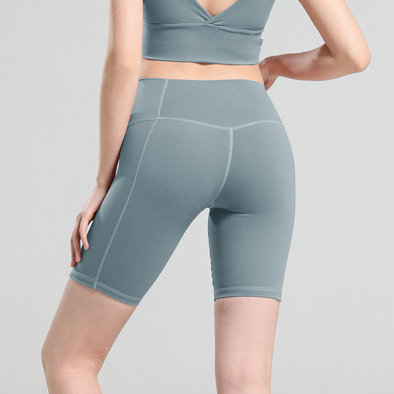 Pantalones cortos de yoga de cintura alta que moldean la cadera