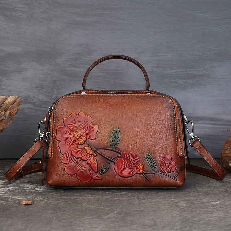 Vintage Cowhide Pillow Bag With Embossed Detailing And A Handheld Design
