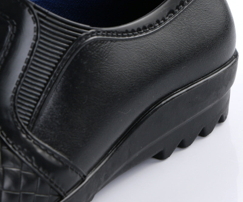 Botas de lluvia de cuero impermeables y a la moda