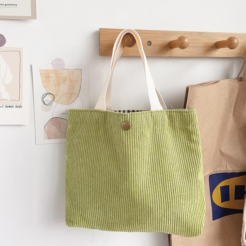 Bolso tote de estilo minimalista con hilo rugoso y estampados a doble cara, un bolso de lona versátil de gran capacidad para mujer