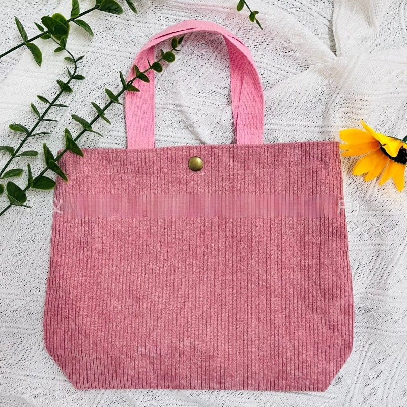 Bolso tote de estilo minimalista con hilo rugoso y estampados a doble cara, un bolso de lona versátil de gran capacidad para mujer