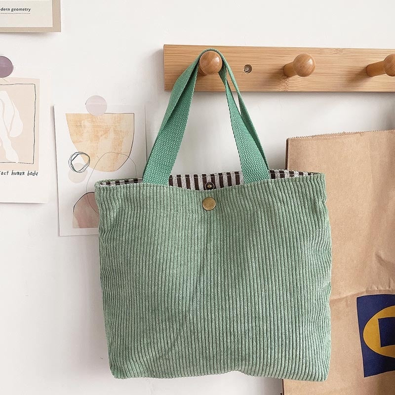 Bolso tote de estilo minimalista con hilo rugoso y estampados a doble cara, un bolso de lona versátil de gran capacidad para mujer