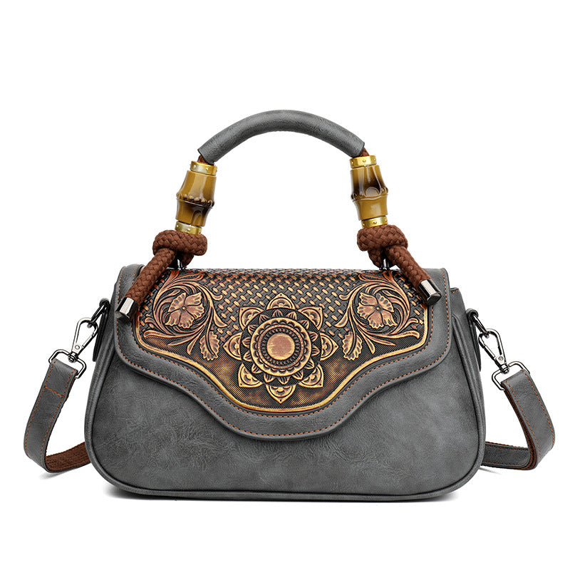 Bolso bandolera retro de cuero repujado artesanal