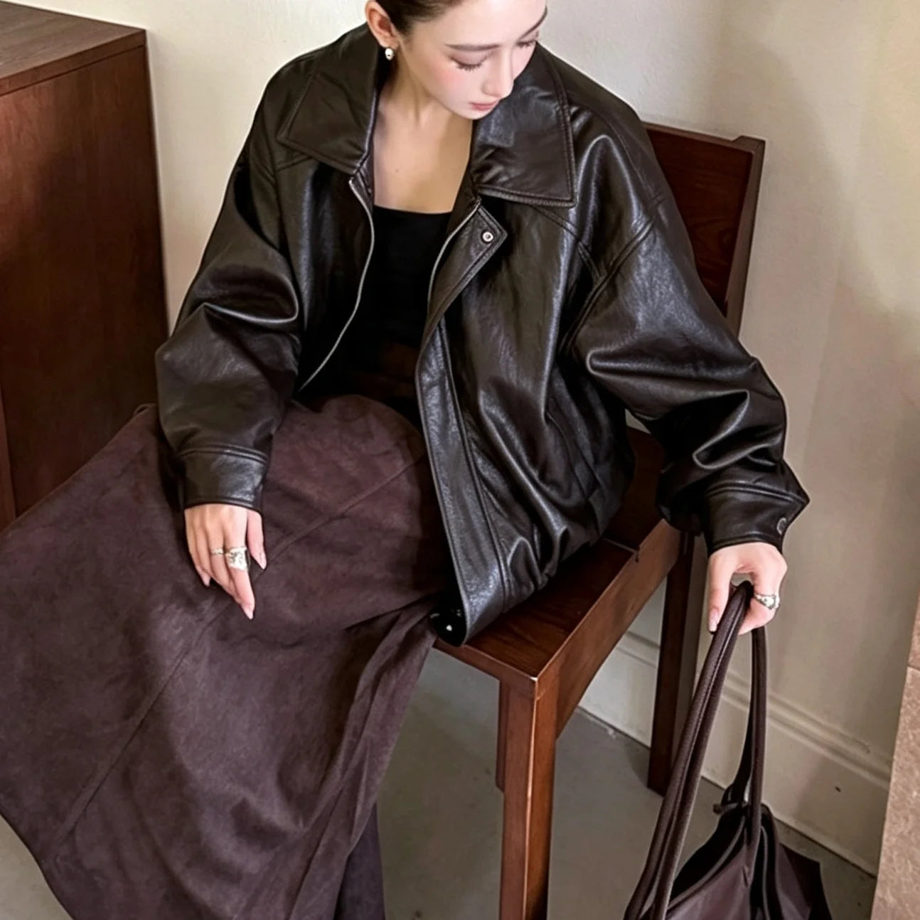 TOKO 2026 New Women Lapel Faux Leather Bomber Jacket Elastic Hem Zip Button Loose Long Sleeve Side Pocket Outerwear Coat