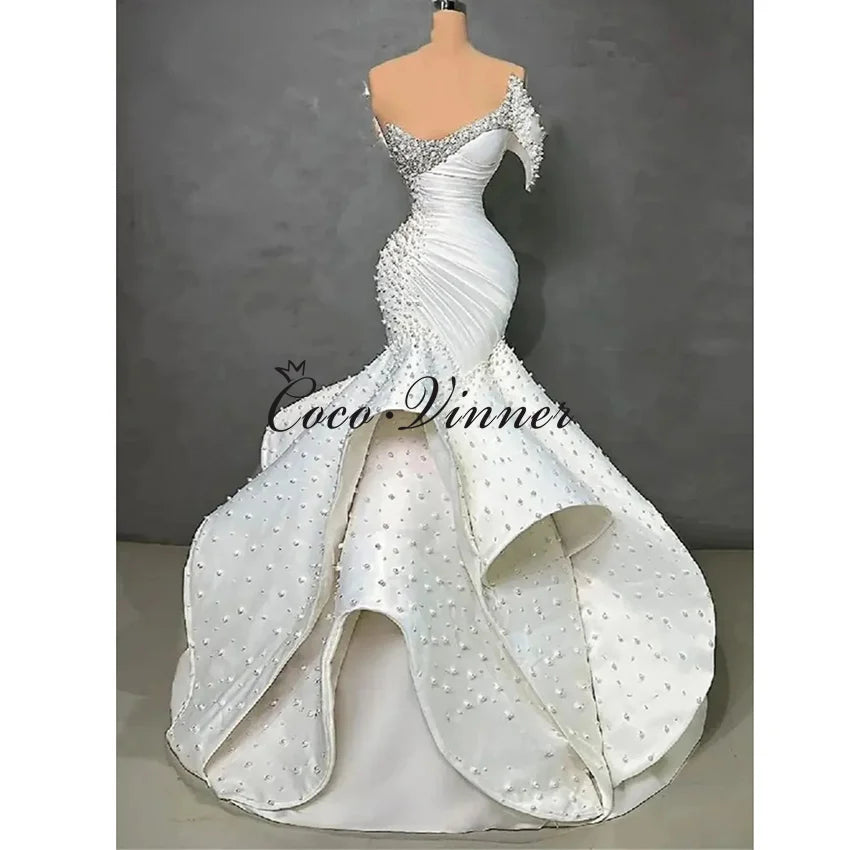 Customized One Shoulder Sleeveless Luxury Mermaid Wedding Dresses 2026 Pearls Beading On Satin Ruffle Wedding Dress Africa W1550