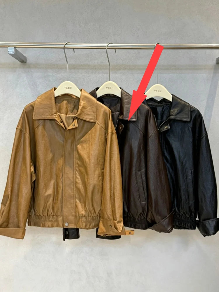 TOKO 2026 New Women Lapel Faux Leather Bomber Jacket Elastic Hem Zip Button Loose Long Sleeve Side Pocket Outerwear Coat