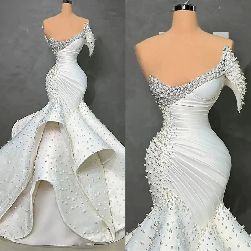 Customized One Shoulder Sleeveless Luxury Mermaid Wedding Dresses 2026 Pearls Beading On Satin Ruffle Wedding Dress Africa W1550