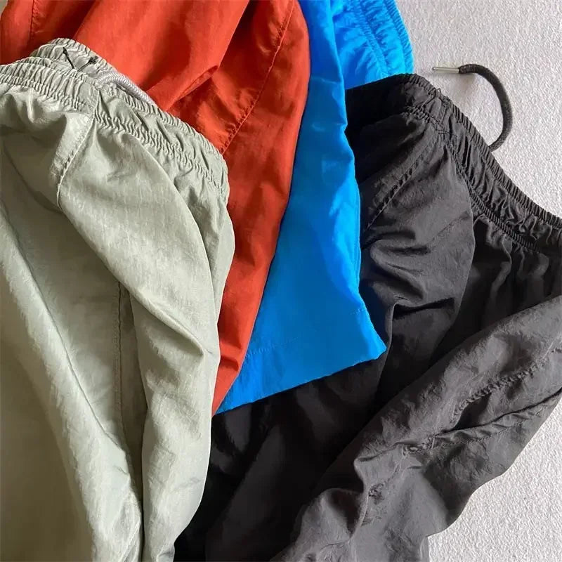 Top quality luxury knee-length  summer youth leisure sports nylon shorts loose men's beach 5-point pants
