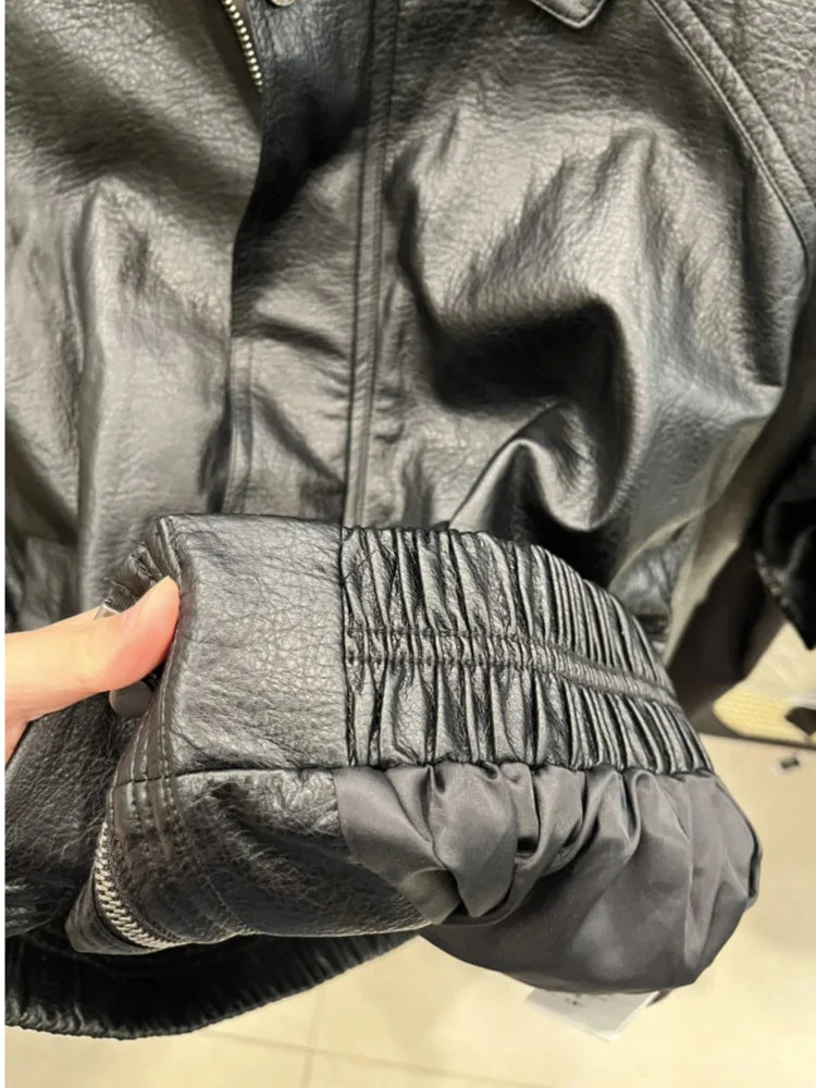 TOKO 2026 New Women Lapel Faux Leather Bomber Jacket Elastic Hem Zip Button Loose Long Sleeve Side Pocket Outerwear Coat