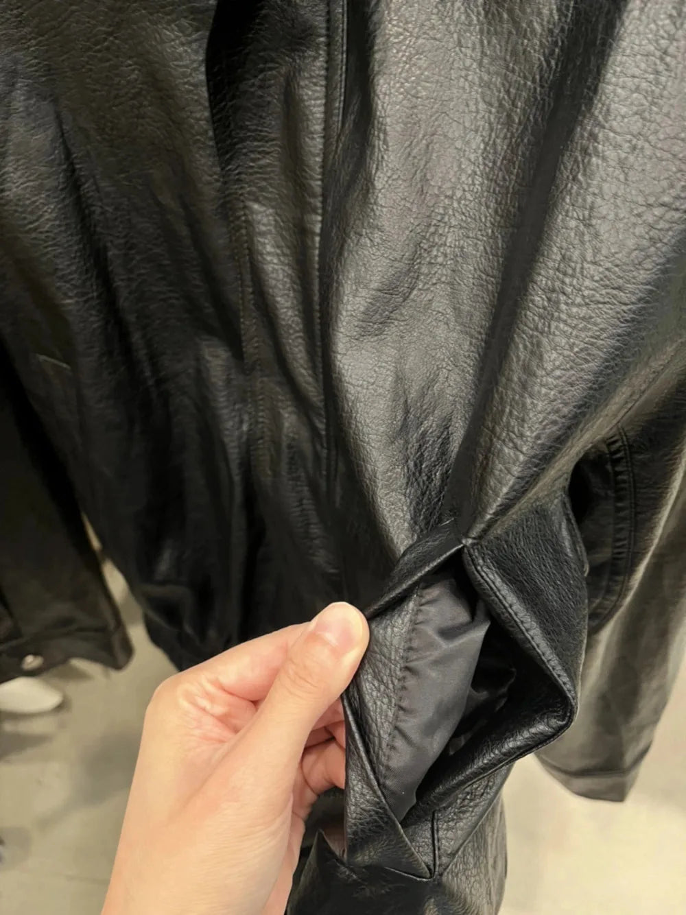 TOKO 2026 New Women Lapel Faux Leather Bomber Jacket Elastic Hem Zip Button Loose Long Sleeve Side Pocket Outerwear Coat
