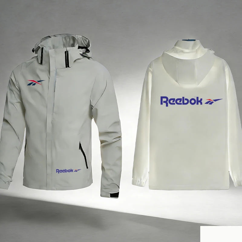 Reebok Logo Men's Waterproof and Windproof Jacket, Lightweight and Minimalist Outerwear, Hooded Outdoor Raincoat, Hiking and Mou