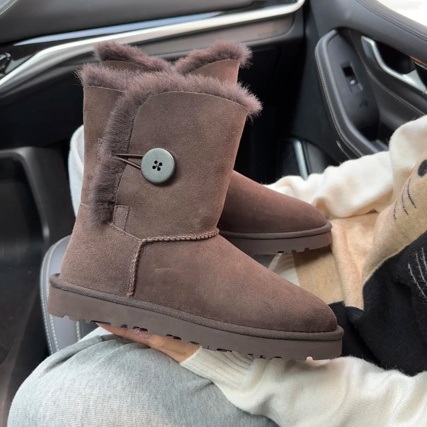 A Pair of Pure Sheepskin and Wool Winter Snow Boots for Women, Warm and Comfortable. Simple and Fashionable Women's Shoes