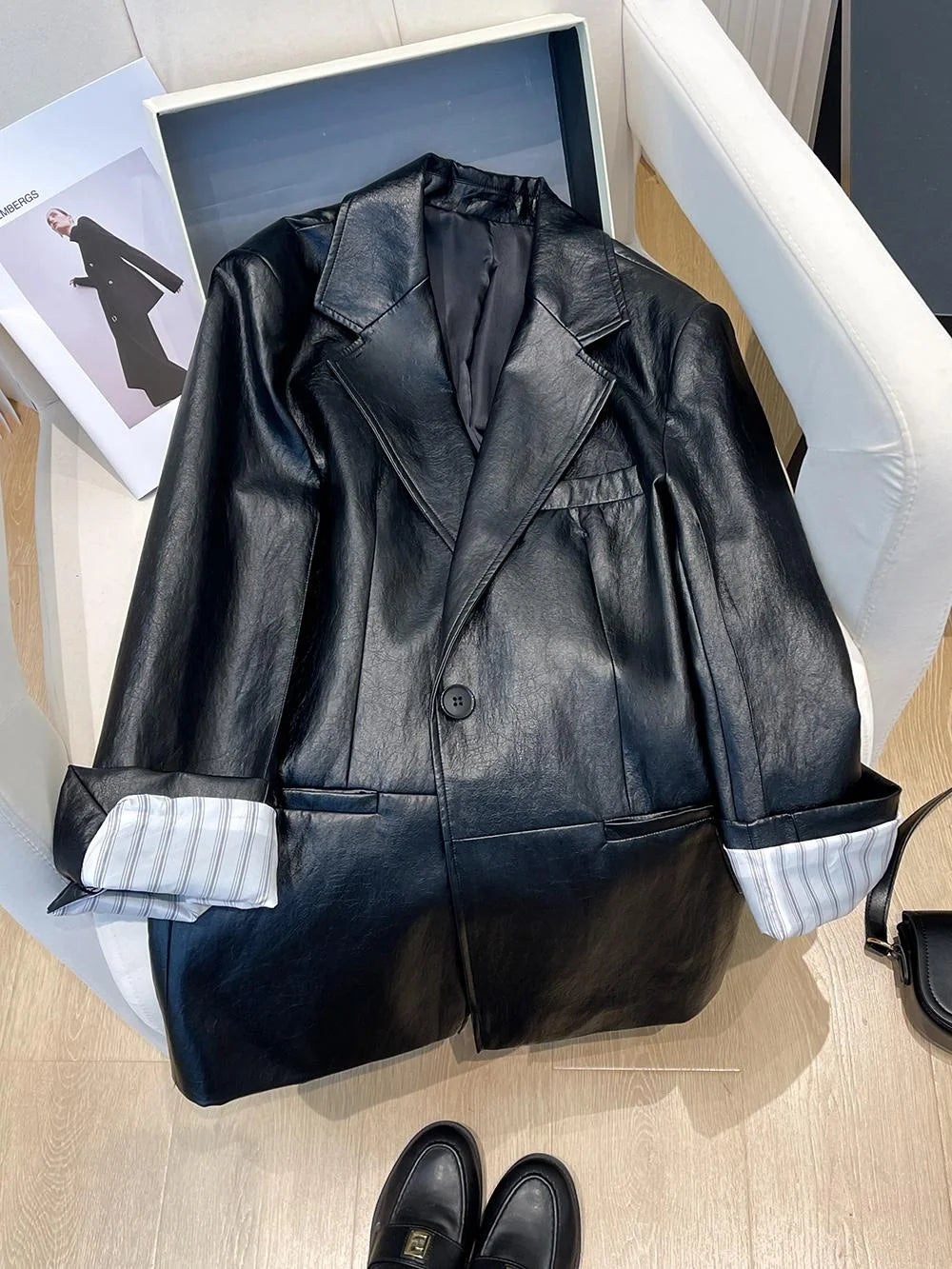 Black Leather Jacket Women's Autumn 2026 New Korean Loose High-End Feeling Personality Suiting PU Material Top Trendy
