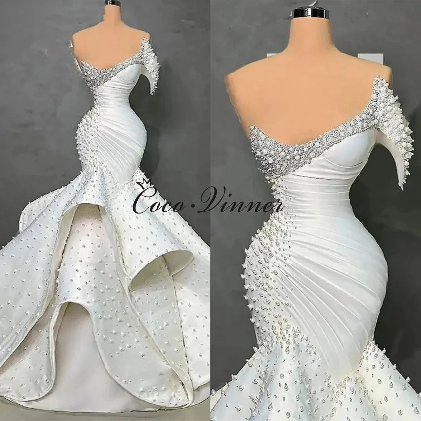 Customized One Shoulder Sleeveless Luxury Mermaid Wedding Dresses 2026 Pearls Beading On Satin Ruffle Wedding Dress Africa W1550