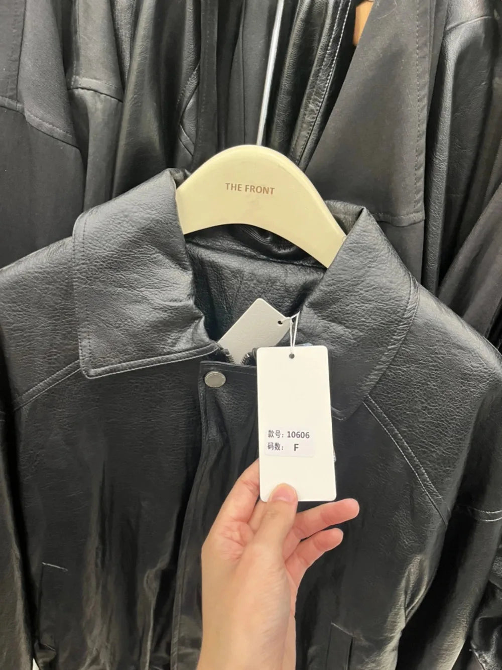 TOKO 2026 New Women Lapel Faux Leather Bomber Jacket Elastic Hem Zip Button Loose Long Sleeve Side Pocket Outerwear Coat