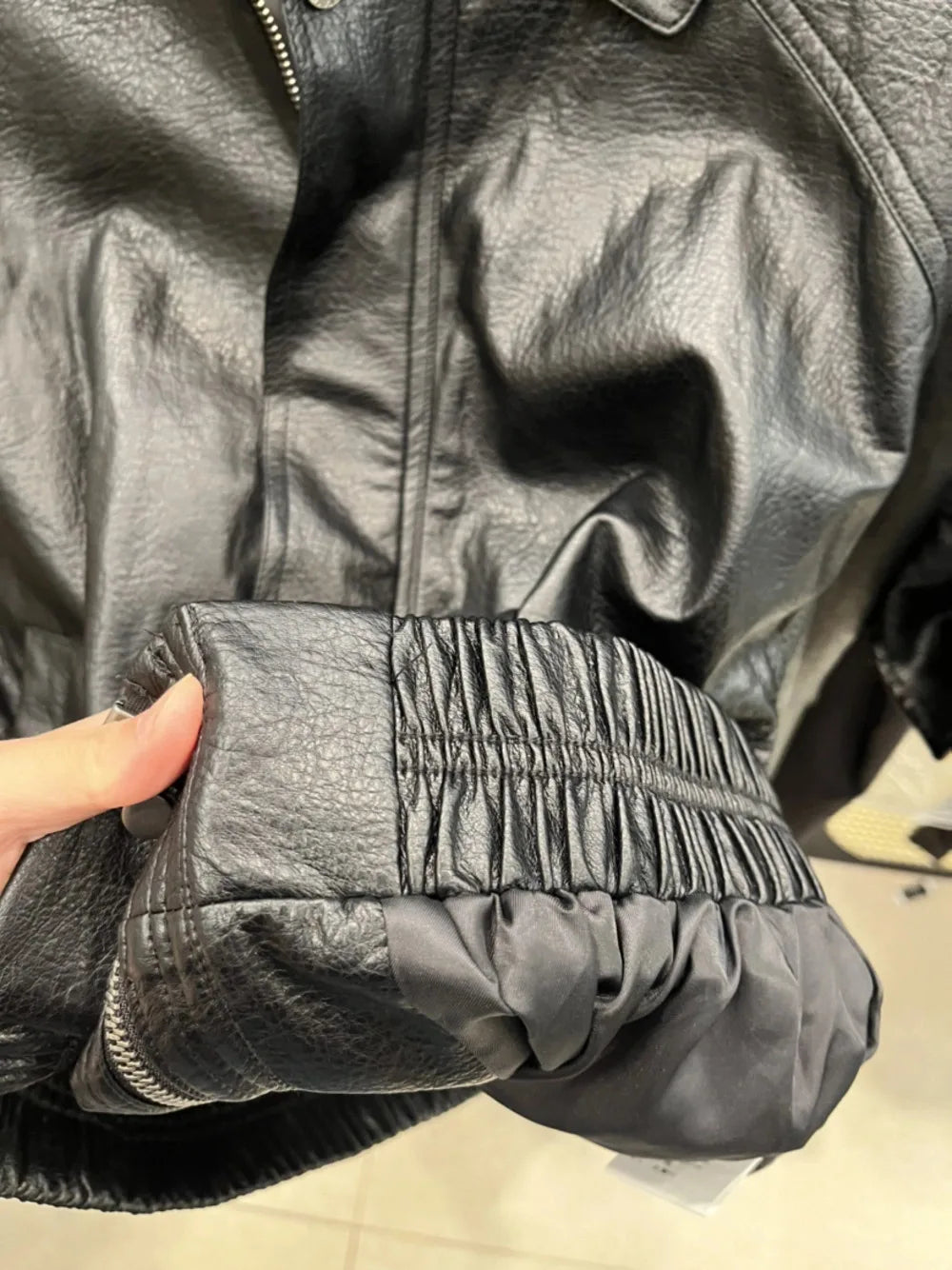 TOKO 2026 New Women Lapel Faux Leather Bomber Jacket Elastic Hem Zip Button Loose Long Sleeve Side Pocket Outerwear Coat