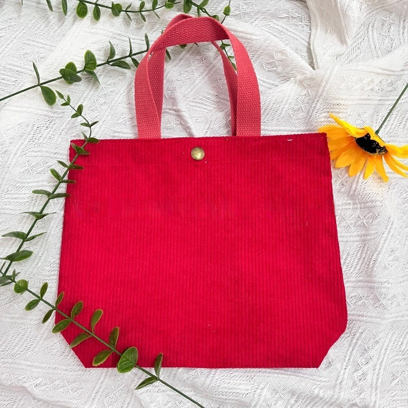 Bolso tote de estilo minimalista con hilo rugoso y estampados a doble cara, un bolso de lona versátil de gran capacidad para mujer