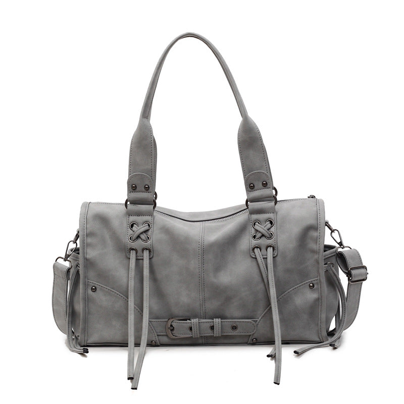Bolso retro de mujer de mano y un solo hombro