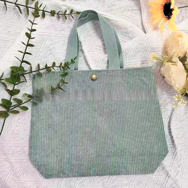 Bolso tote de estilo minimalista con hilo rugoso y estampados a doble cara, un bolso de lona versátil de gran capacidad para mujer